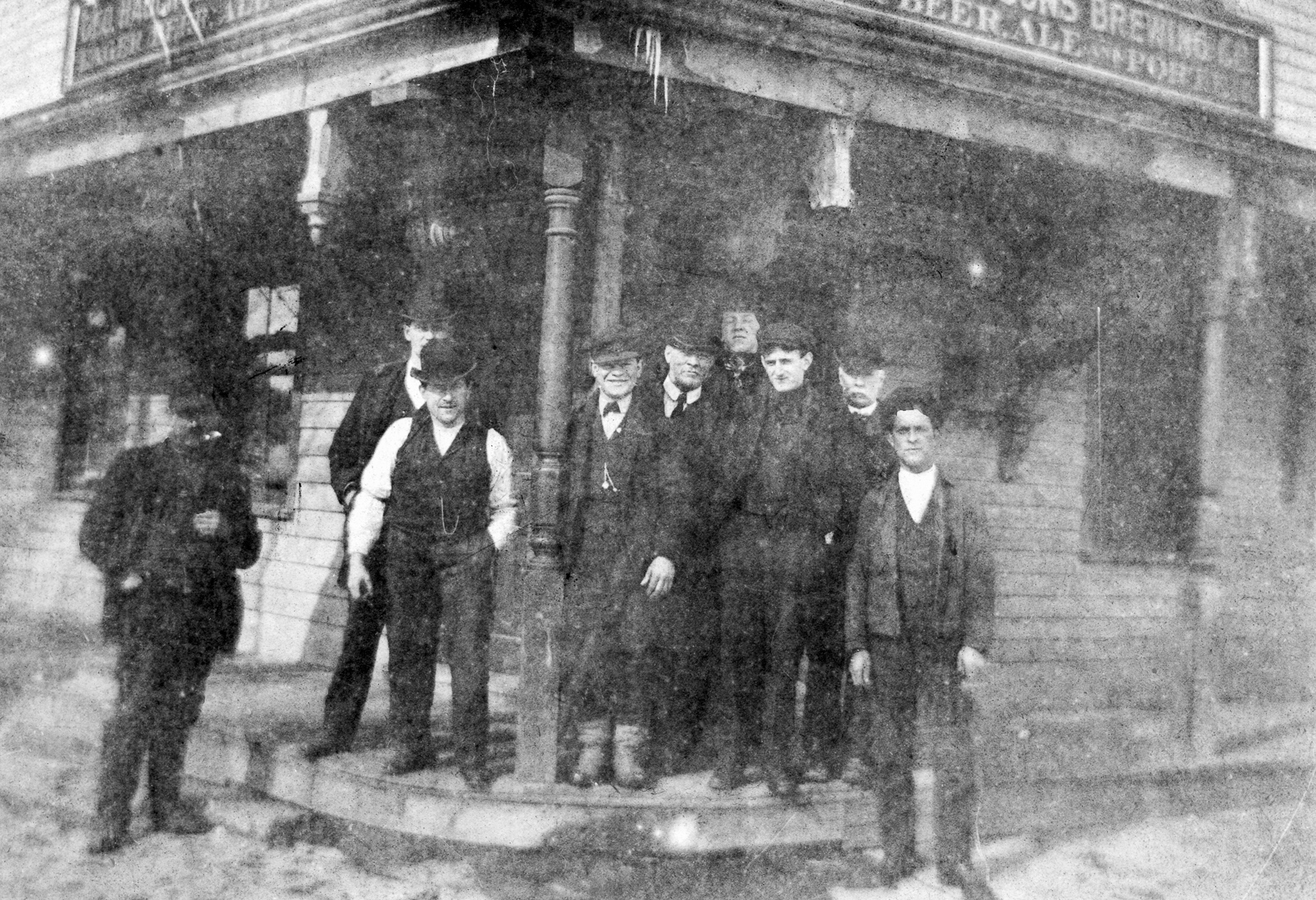 Probably brothers George "Frank", Daniel "Coady" and John S. McManus (in front from post to right); brother Henry McManus may be on far left